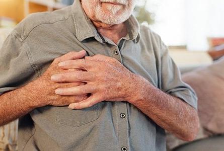 Man with his hand over his heart